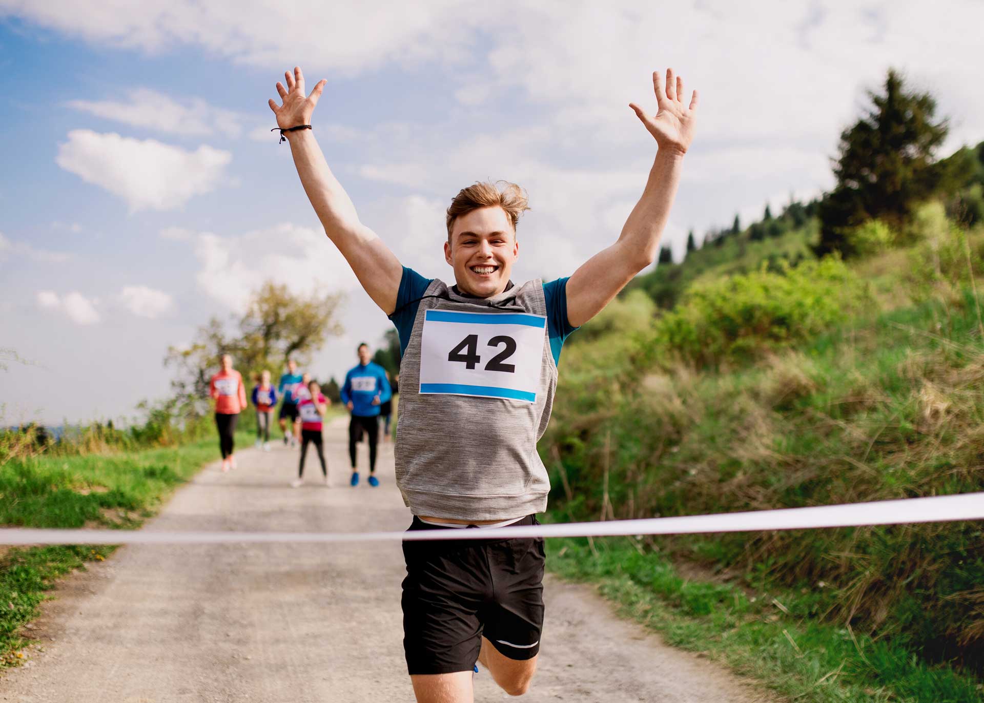 Powerful Mind Counselling | Image of man crossing finish line.